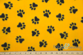 Buy plush-paws-yellow-black Plush Paws Anti-Pill Polar Fleece Fabric Polyester 13 Oz 58-60"